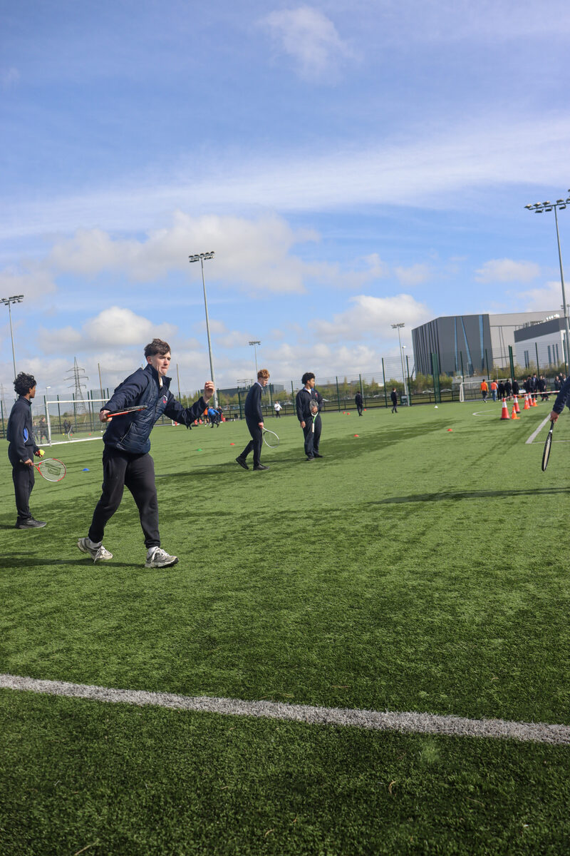 Students taking part in an activity on the sports field