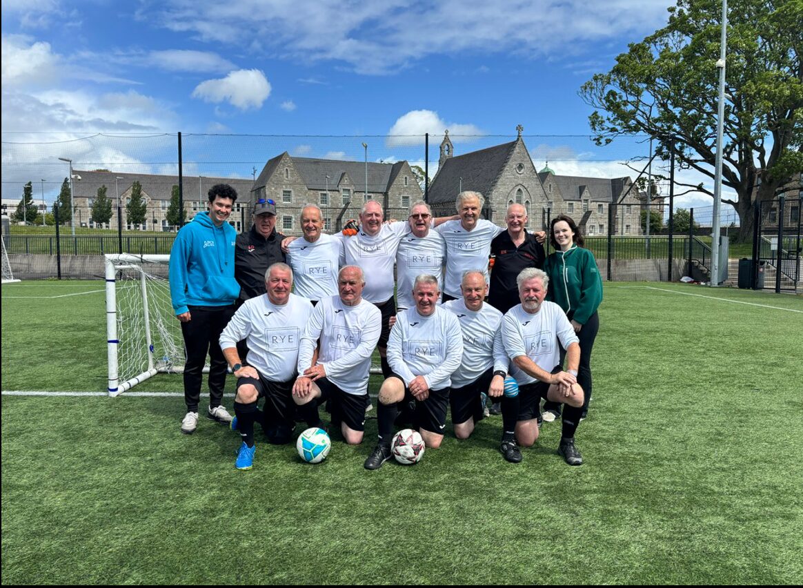 A walking football team photographed together after a match